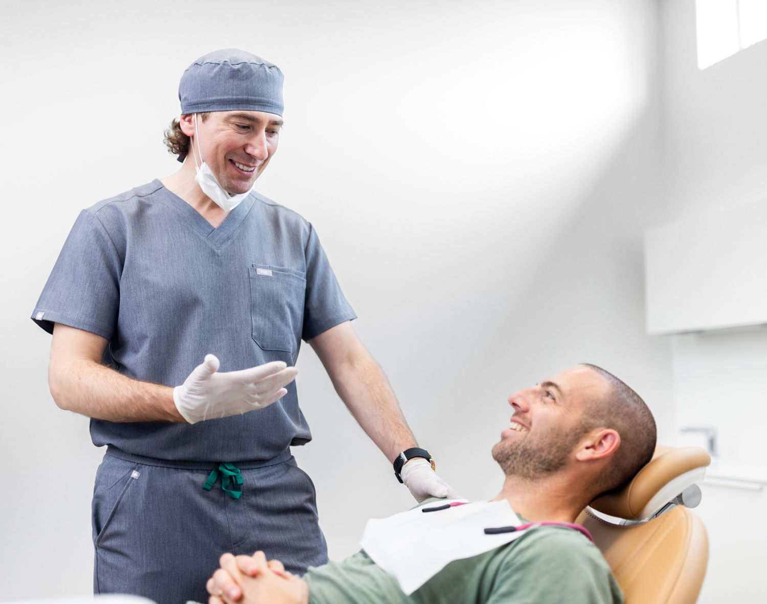 clark dentist Dr. Szabela speaking with patient
